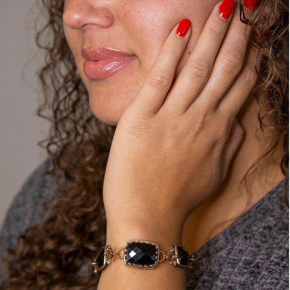 Black Onyx golden link bracelet from Start2Finish featuring sleek black onyx stones and gold-toned metal links.