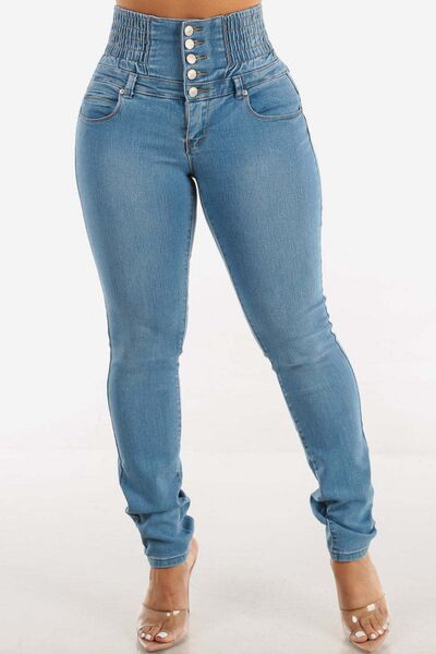 Taupe Oliver high waist skinny jeans with button detail, designed to lift hips and flatter curves, shown with a casual T-shirt.