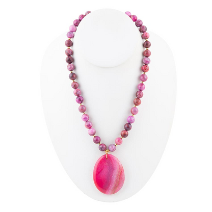 Pink magenta agate slab pendant necklace featuring a polished, natural stone pendant with silver bail on a matching chain.