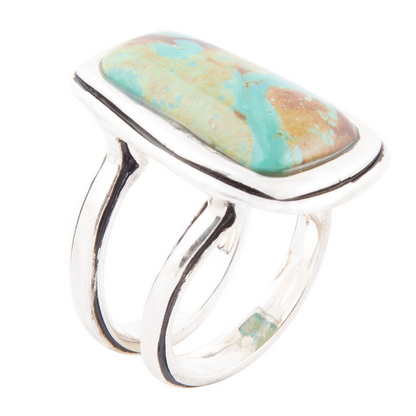 Art Blue turquoise and sterling silver statement ring featuring intricate jewelry design with bold blue stone and detailed silver band.