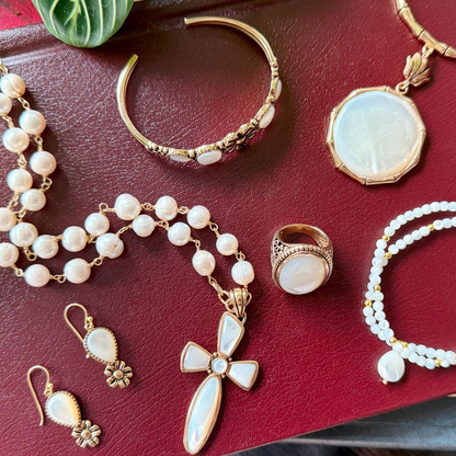 Las Cruces white pearl cross pendant necklace featuring a silver chain and a white pearl cross charm, jewelry accessory.