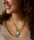 Blue turquoise, white pearl, and gold pendant necklace with multiple charms, stylish jewelry by Start2Finish.