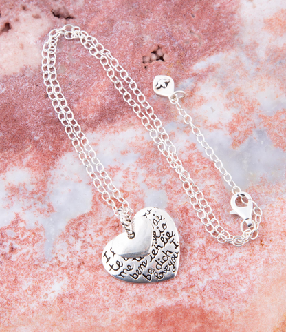 Sterling silver engraved heart pendant necklace with intricate design, jewelry piece from Start2Finish, displayed on a chain.