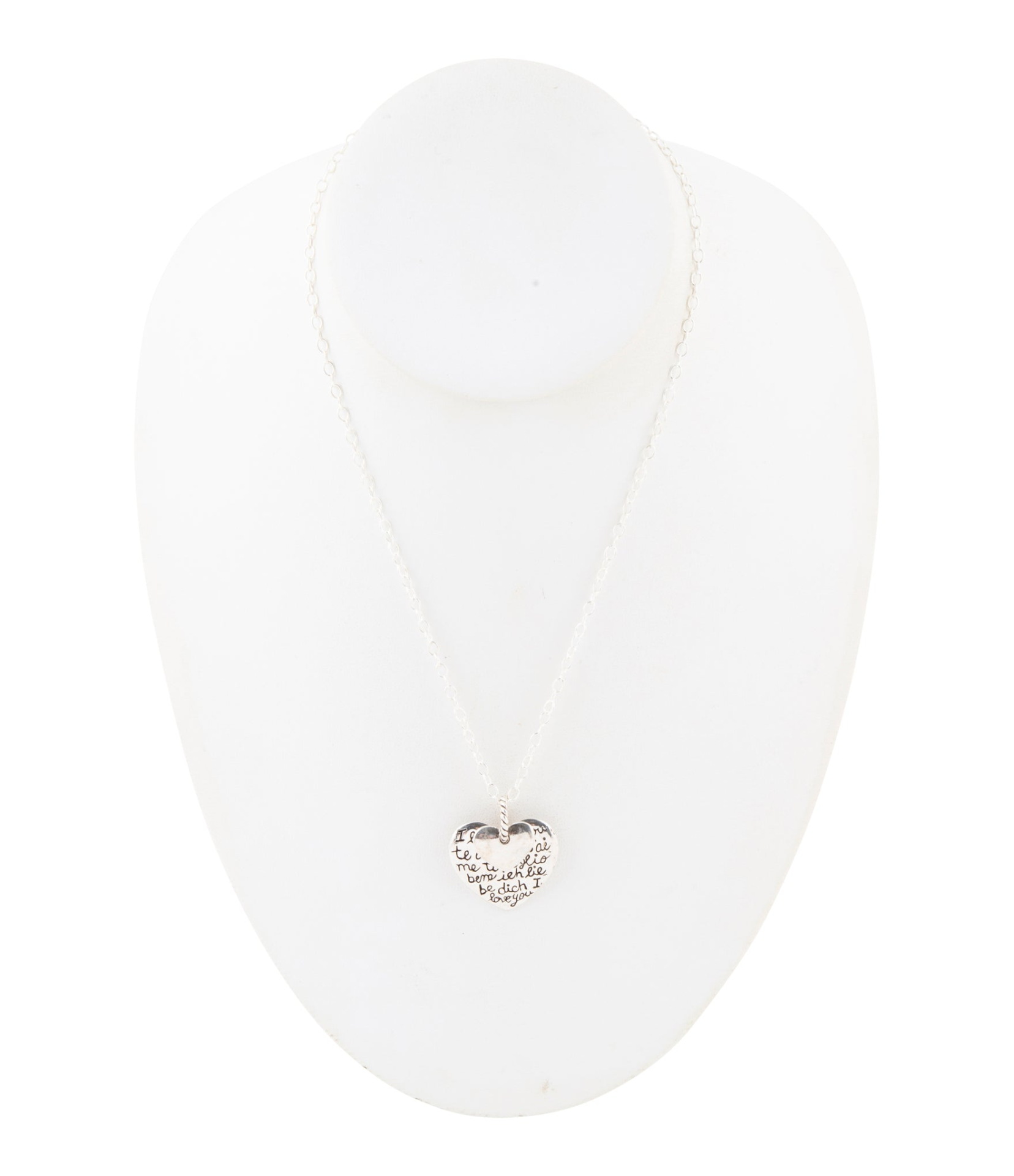 Sterling silver engraved heart pendant necklace with intricate detailing, jewelry piece featuring a polished heart charm.