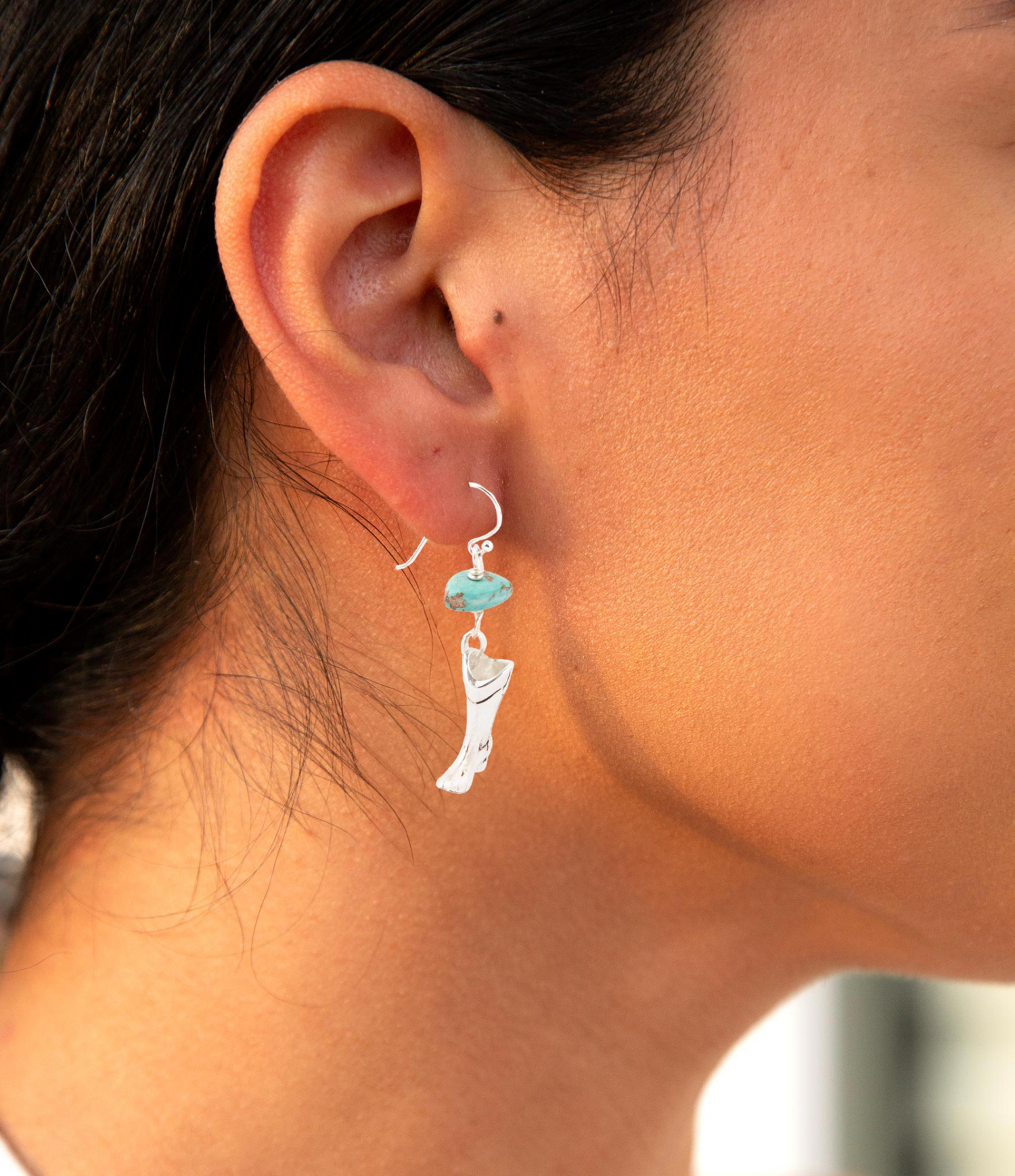 Sterling silver boot charm and blue turquoise earrings with silver hooks, jewelry set featuring turquoise stones and detailed metalwork.