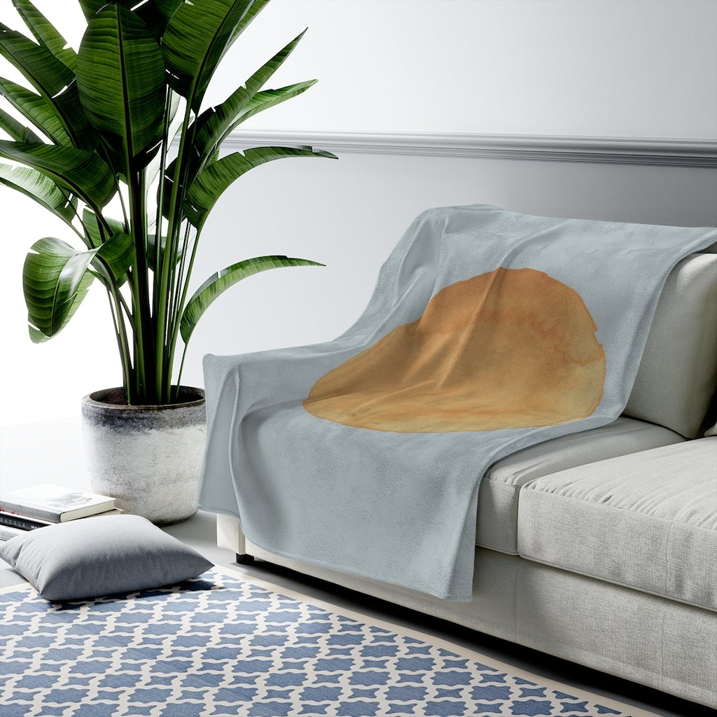 Blue plush throw with abstract sun art design by Yellow Pandora, available in three sizes, perfect for home decor.
