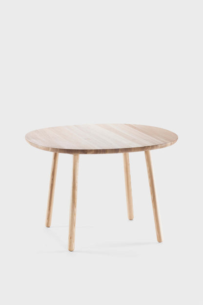 Natural wooden Naïve dining table by Aquamarine Poppy, showcasing a sleek, modern furniture design with a smooth finish.