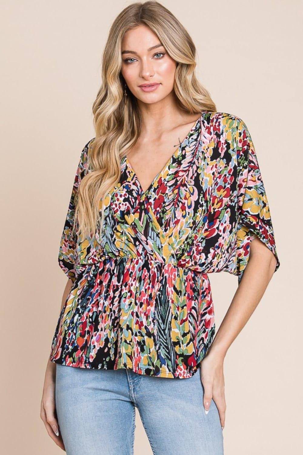 Carmine Juneberry BOMBOM printed surplice peplum blouse with long sleeves and floral pattern, styled as a fashionable women&