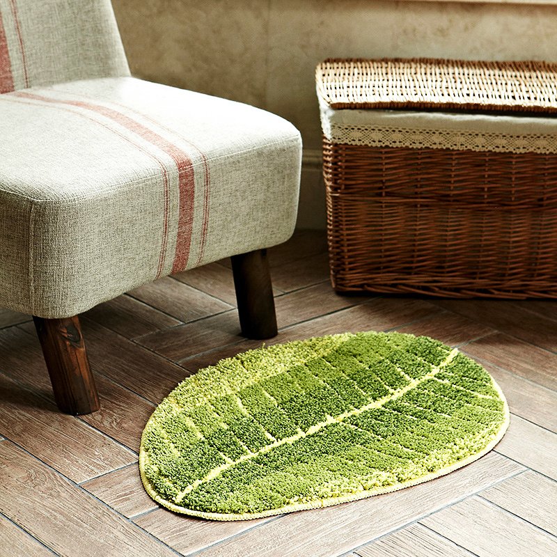 Fuchsia Molly banana leaf carpet with green and beige tropical leaf design for home decor, textured woven fabric.