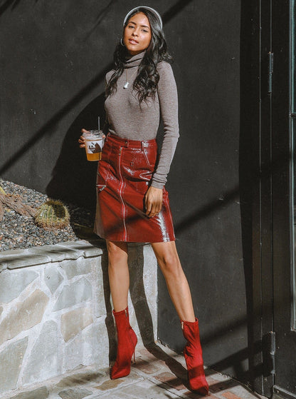 Azure Thanatos Bordeaux faux leather zip-up pencil skirt for women, close-up of the fitted skirt with zipper detail.