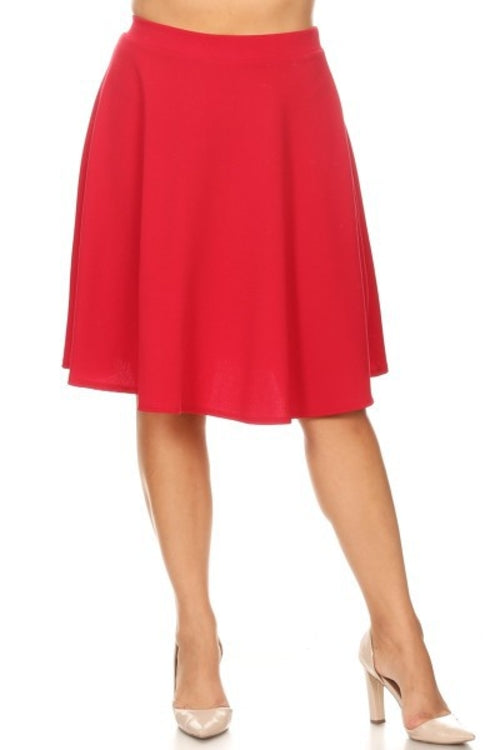 Solid high-waisted A-line knee-length skirt for women by Jade Icarus, shown in a natural fabric with a smooth finish.