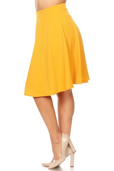 Solid high-waisted A-line knee-length skirt for women by Jade Icarus, shown in a natural pose, highlighting the fabric and fit.