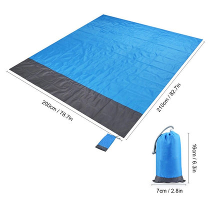 Maroon Asteria portable waterproof picnic and beach mat, camping pocket blanket spread out on grass, ideal for outdoor activities