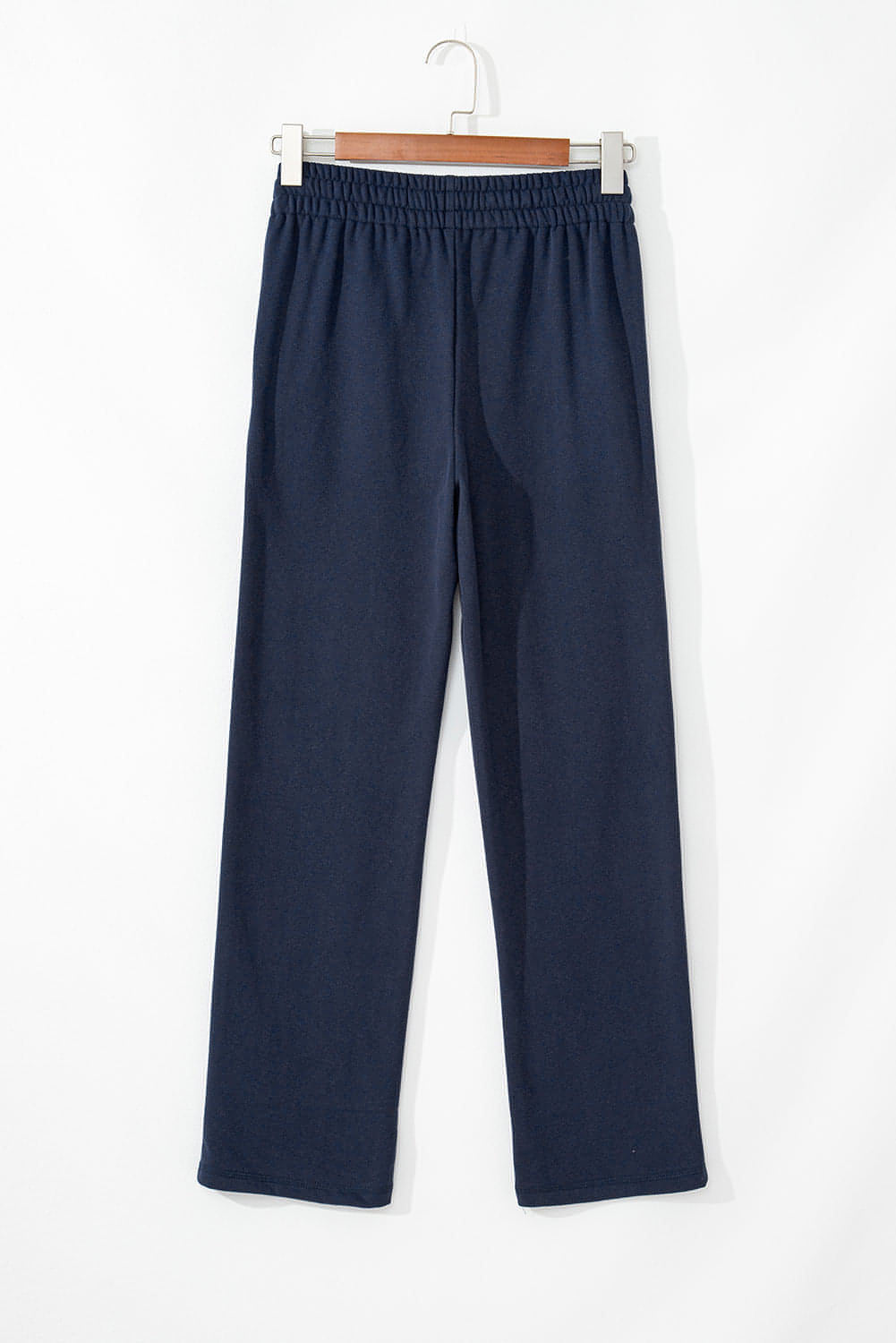 Navy blue fleece-lined casual pants with drawstring waist by Carmine Juneberry, comfortable and stylish for everyday wear.