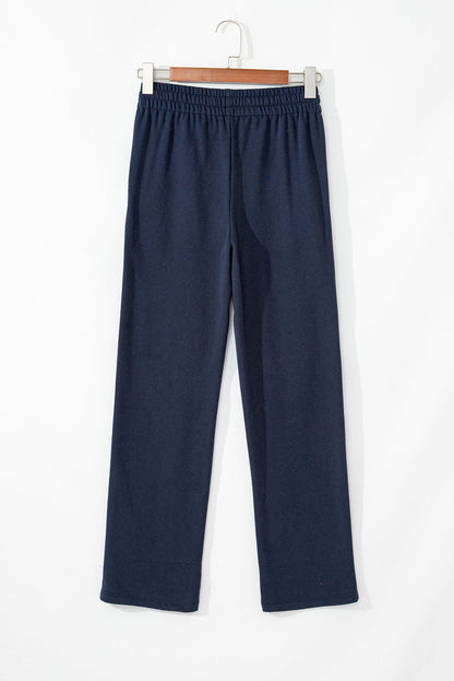 Navy blue fleece-lined casual pants with drawstring waist by Carmine Juneberry, comfortable and stylish for everyday wear.