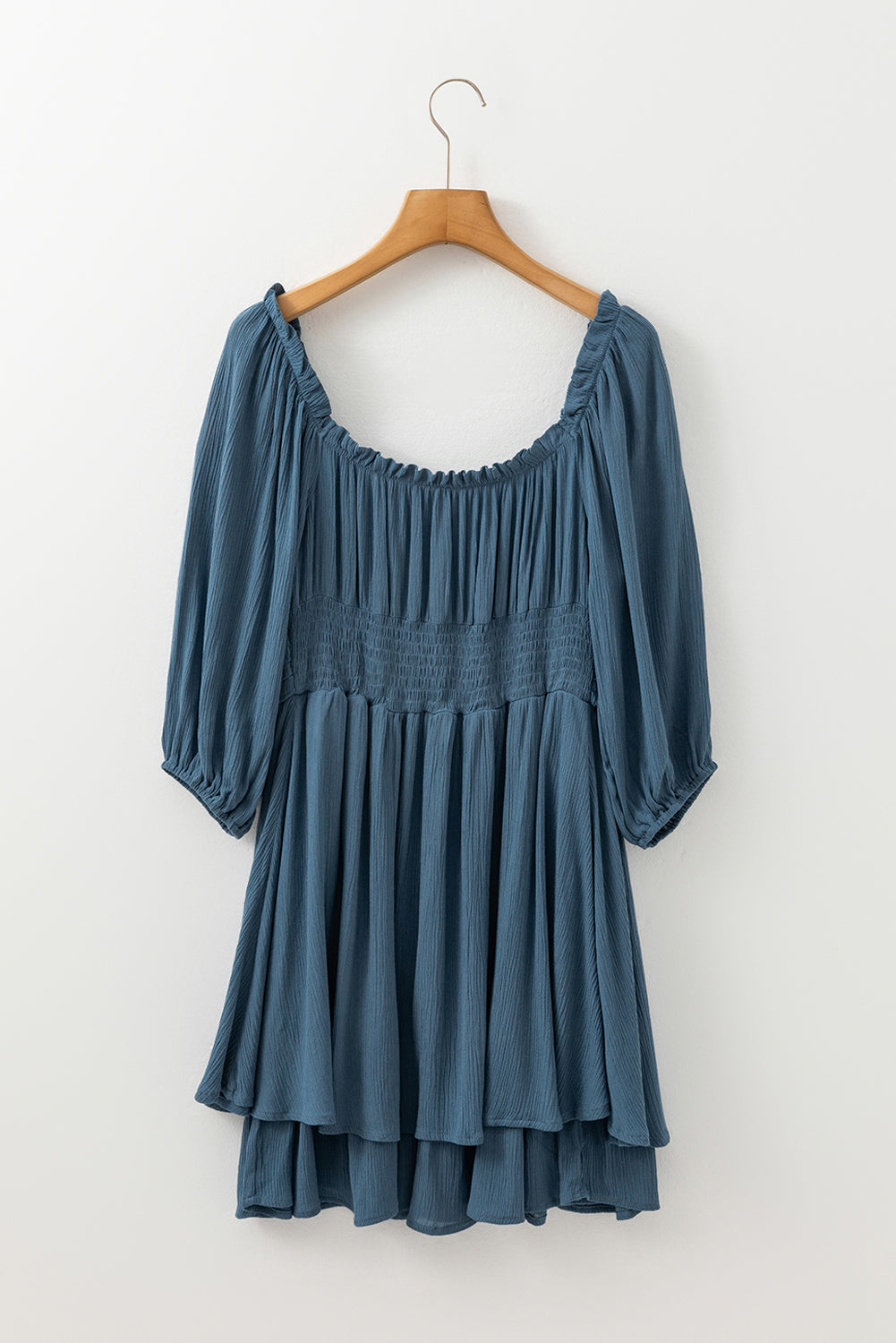 Byzantium Bay solid ruched frilled neck 3/4 sleeve dress displayed on a model, showcasing elegant design and feminine details.