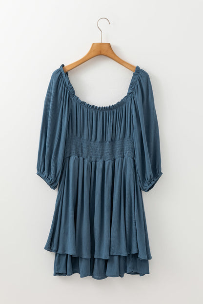 Byzantium Bay solid ruched frilled neck 3/4 sleeve dress displayed on a model, showcasing elegant design and feminine details.