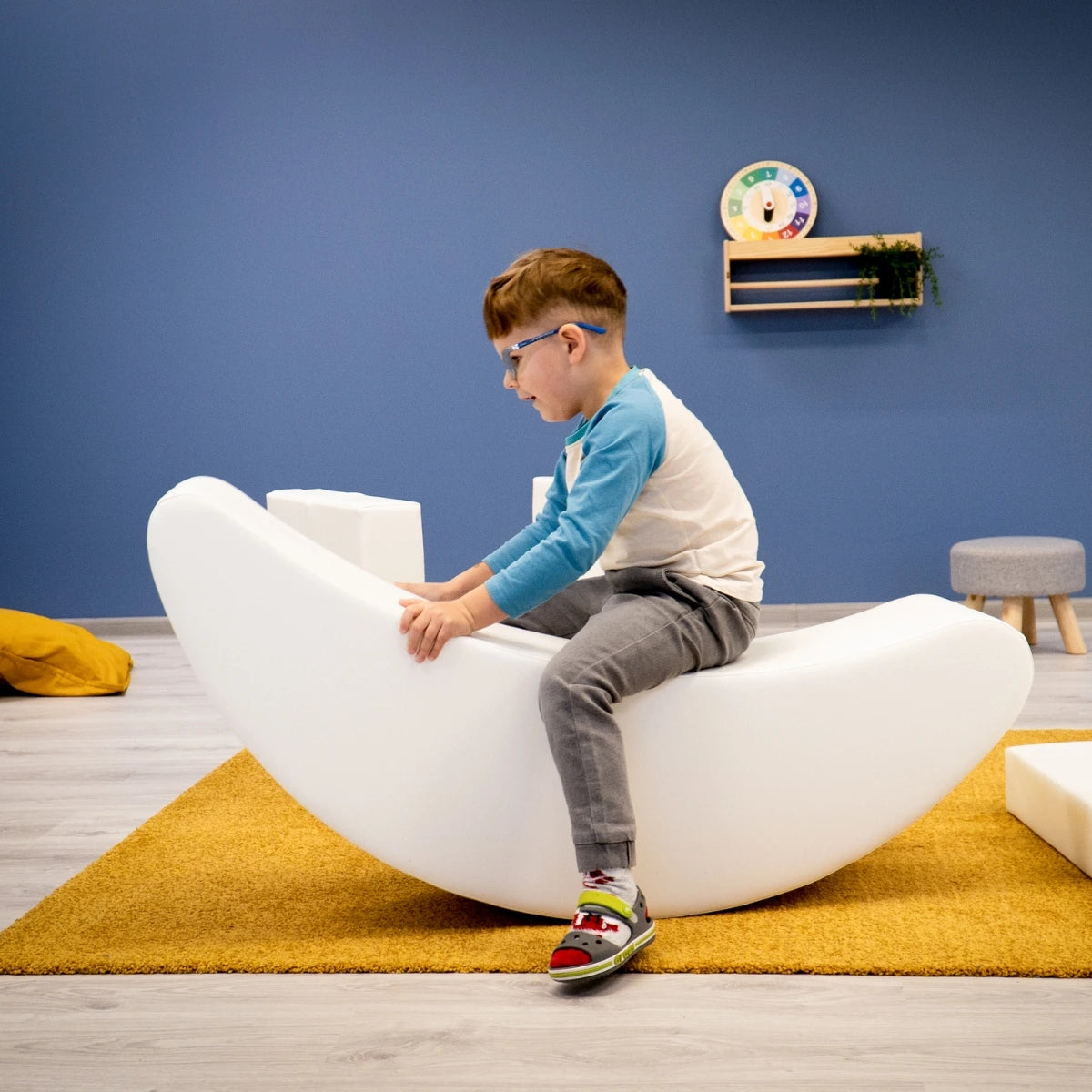 Blush Apricot furniture banana-shaped decorative piece with smooth finish and vibrant yellow color on a plain background.