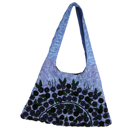 Blue trapezoid Rococo handbag by Erin Hercules, stylish accessories with intricate design, shown in Guatemala.