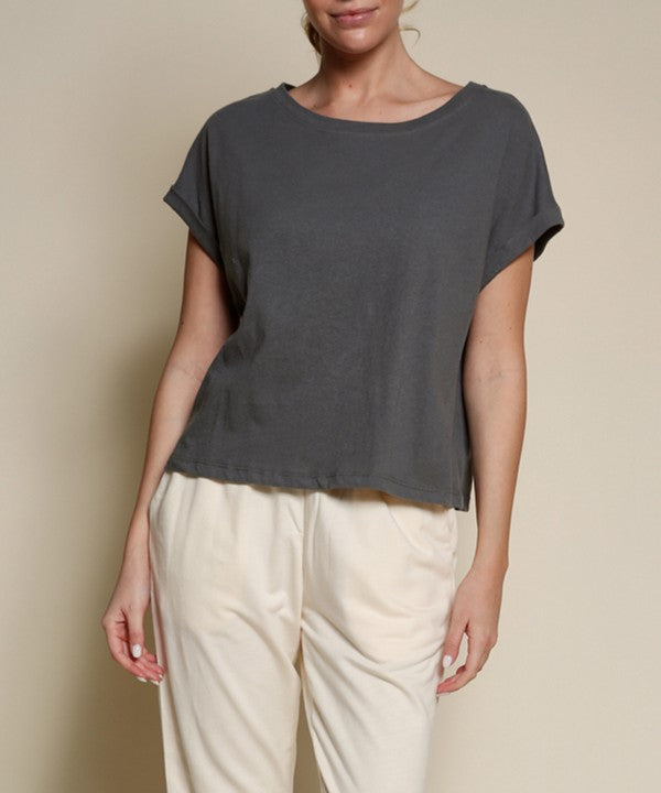 Recycled cotton plain crop top for women by Jade Icarus, shown in a natural pose highlighting the fabric and fit.