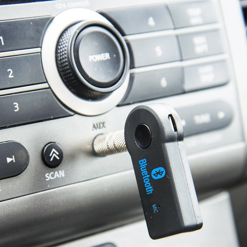 Fuchsia Molly HiFi Bluetooth music receiver connected to audio equipment for wireless streaming of high-quality sound.