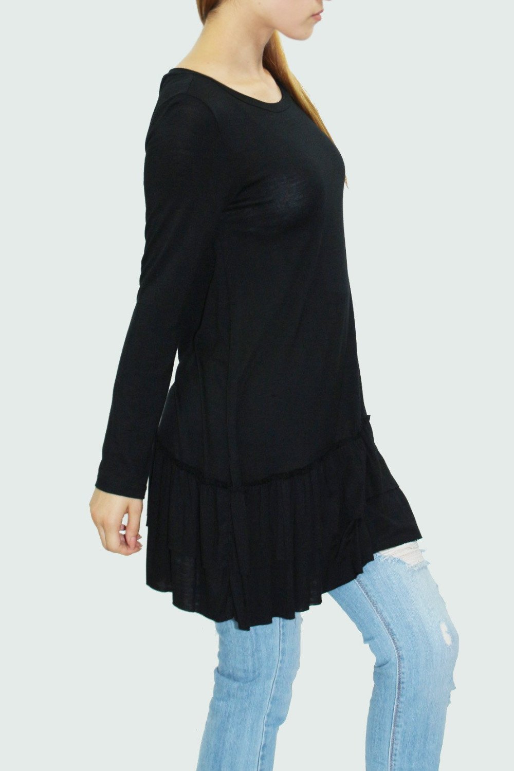 Black ruffle bottom long sleeve tunic by Yellow Hera, stylish women’s clothing with feminine ruffle details and a comfortable fit.