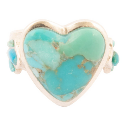 Sterling silver statement ring with a blue turquoise heart design, featuring intricate jewelry detailing.