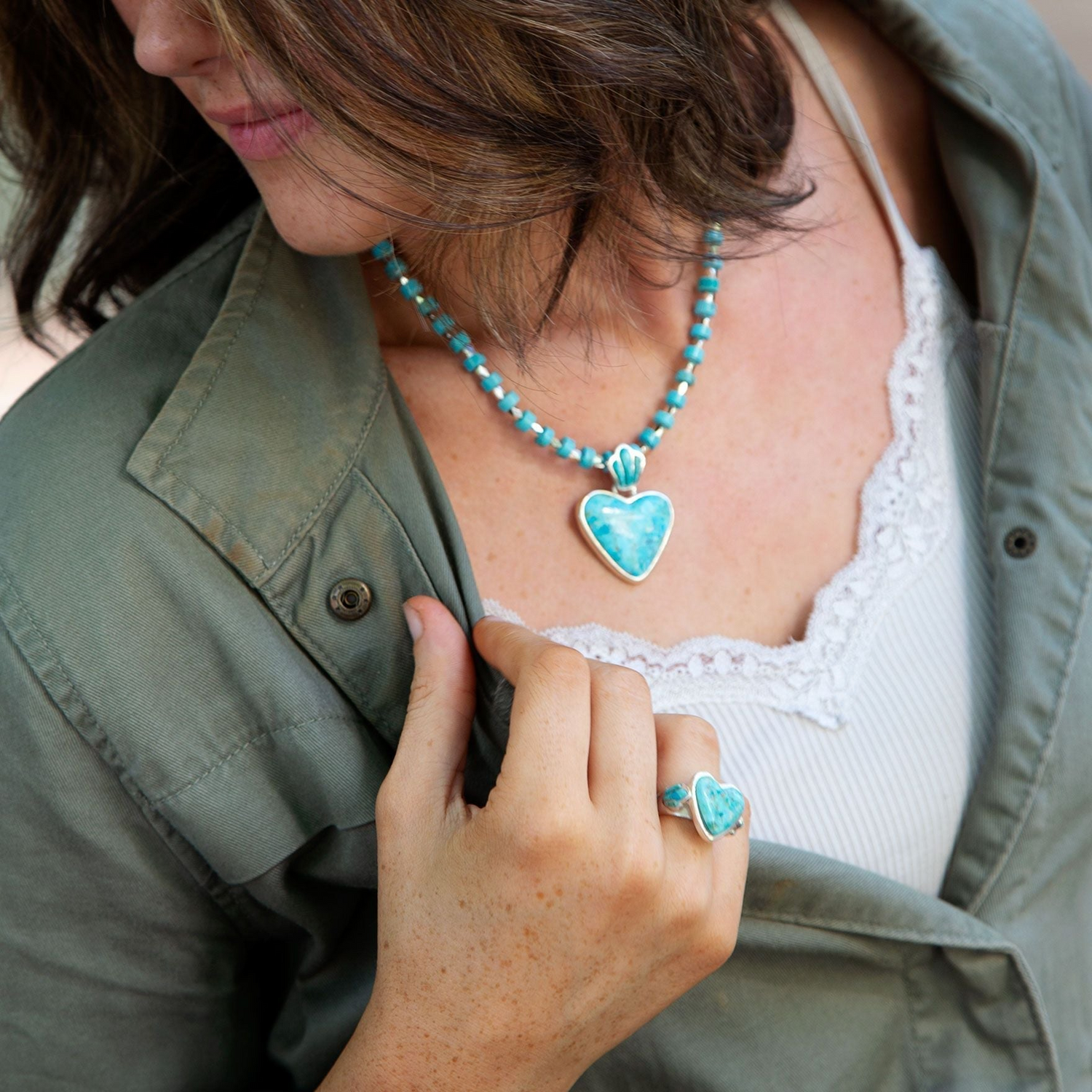 Blue turquoise heart sterling silver statement ring, jewelry piece with a bold heart design and polished silver finish.