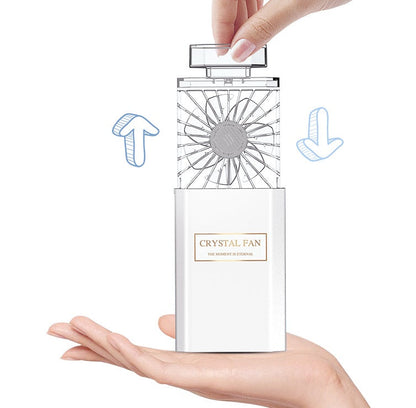 Portable Carmine Juneberry perfume fan with USB rechargeable bodycare diffuser, compact device for personal fragrance.