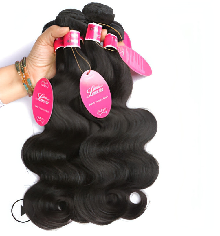 Carmine Juneberry EternaWave Brazilian wave hair wig with long, wavy, natural-looking hair on a mannequin head.