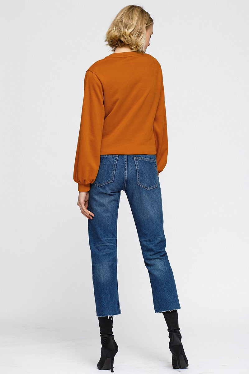 Women’s Lemon Hera V-neck wrap front sweatshirt, cozy sweater with long sleeves and a stylish V-neck design.