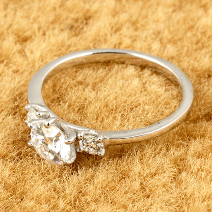 Sterling silver white moissanite 3-stone ring with elegant design, showcasing sparkling gemstones and smooth band detail.