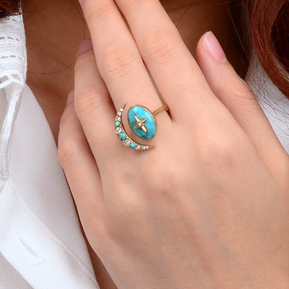 Celestial Blue Turquoise and gold bypass ring featuring a sleek, modern jewelry design with intricate details and a polished finish.