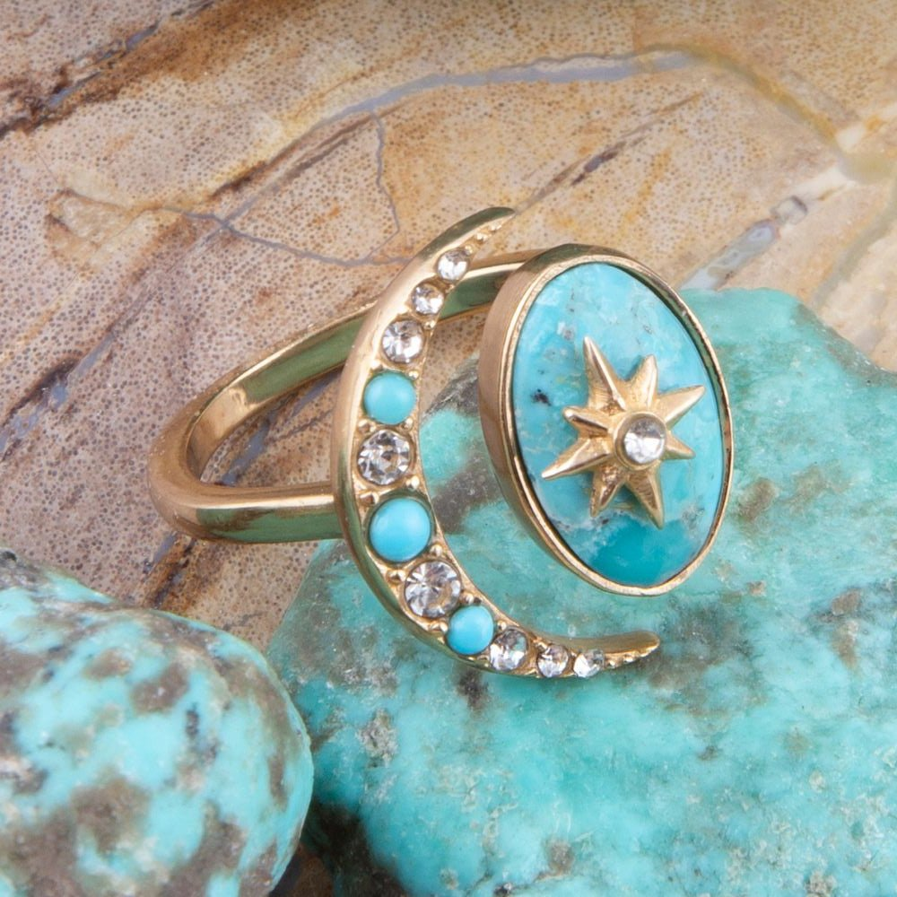 Celestial Blue Turquoise and gold bypass ring with intricate jewelry design, featuring a stunning turquoise centerpiece.