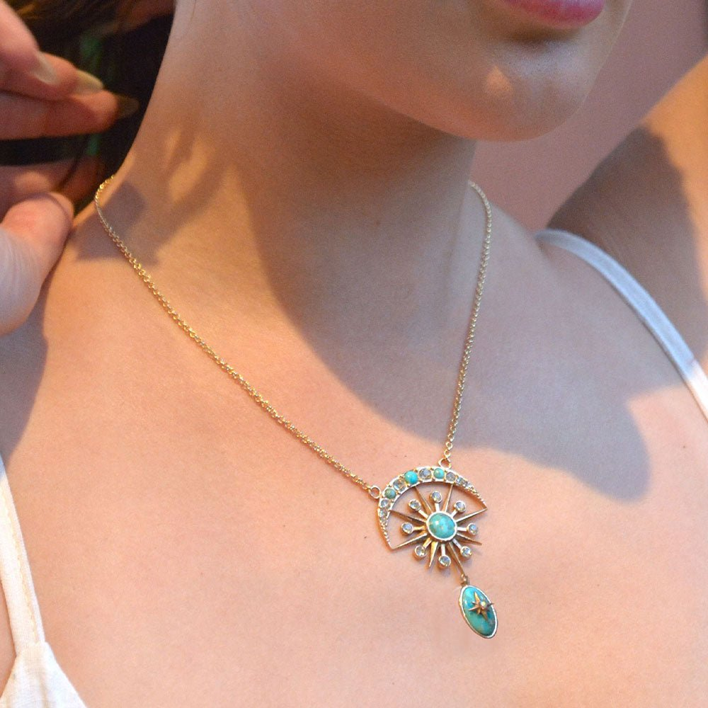 Celestial Blue Turquoise necklace with gold drop pendant, jewelry piece featuring vibrant turquoise and elegant gold accents.