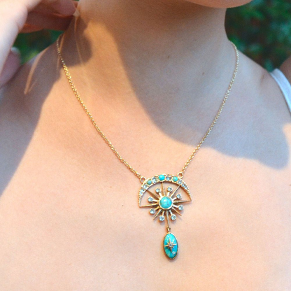 Celestial Blue turquoise and gold drop necklace from Start2Finish featuring a vibrant turquoise pendant with gold accents.