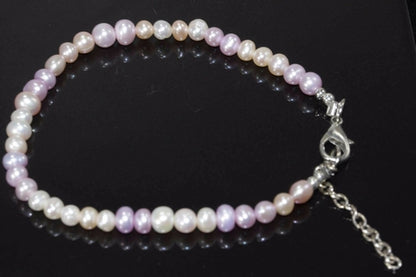 Silver Hestia Pearly Pink Sands bracelet featuring soft pink beads and delicate silver accents, styled on a white background.