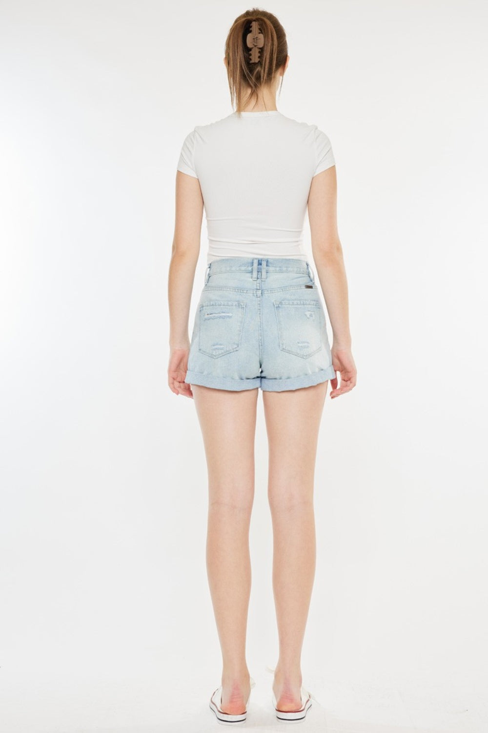 High-rise Kancan repaired mom denim shorts with distressed details and frayed hems, styled by Jade Icarus.