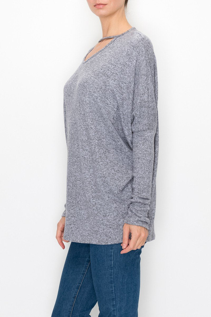 Grey cutout front long sleeve top by Yellow Hera, stylish and fitted clothing with a unique neckline design.