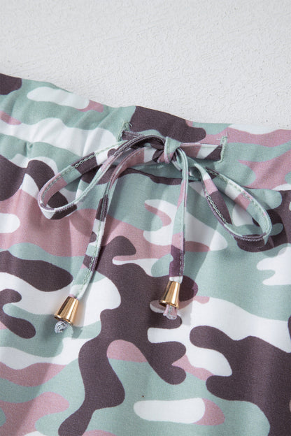 Byzantium Bay camo drawstring high waist mini skort worn by a woman, featuring a stylish camouflage pattern and adjustable waistband.