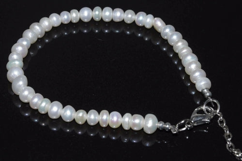 Elegant Silver Hestia cultured freshwater pearls bracelet with a delicate strand of lustrous pearls and a silver clasp.