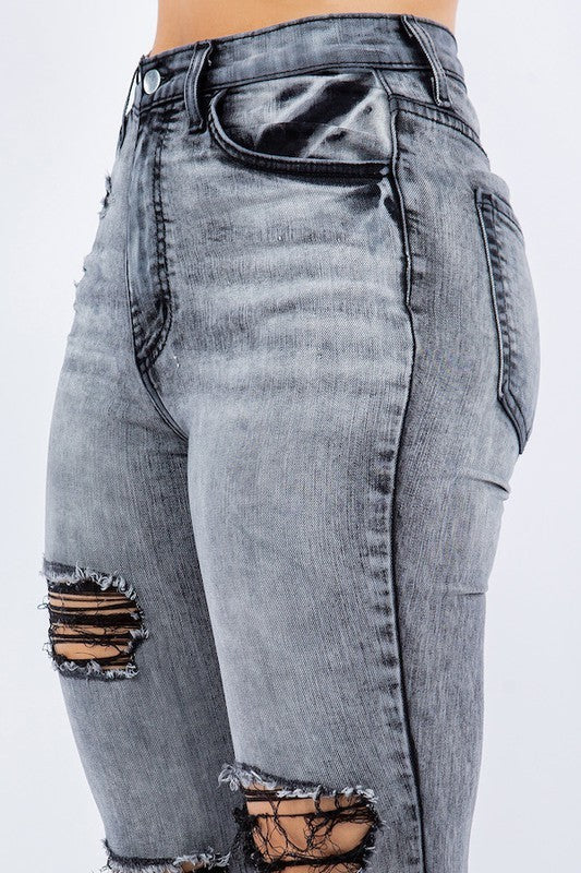 Grey Storm Bell Bottom Jeans by Jade Icarus with flared legs and high-waist fit, shown on a model.