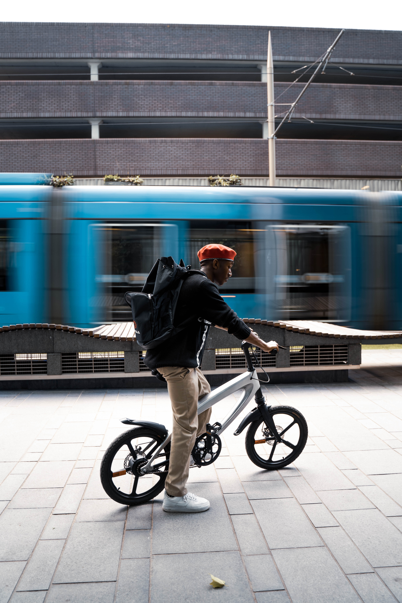 Start2Finish Racing White E-Bike with built-in speakers and Bluetooth, showcasing sleek design and handlebar controls.