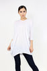 White oversized shirt dress by Yellow Hera, displayed on a hanger, featuring a relaxed fit and classic collar design.