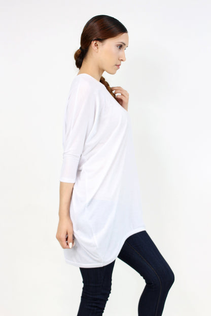 White oversized shirt dress by Yellow Hera, casual clothing with a relaxed fit, featuring long sleeves and a button-front design.