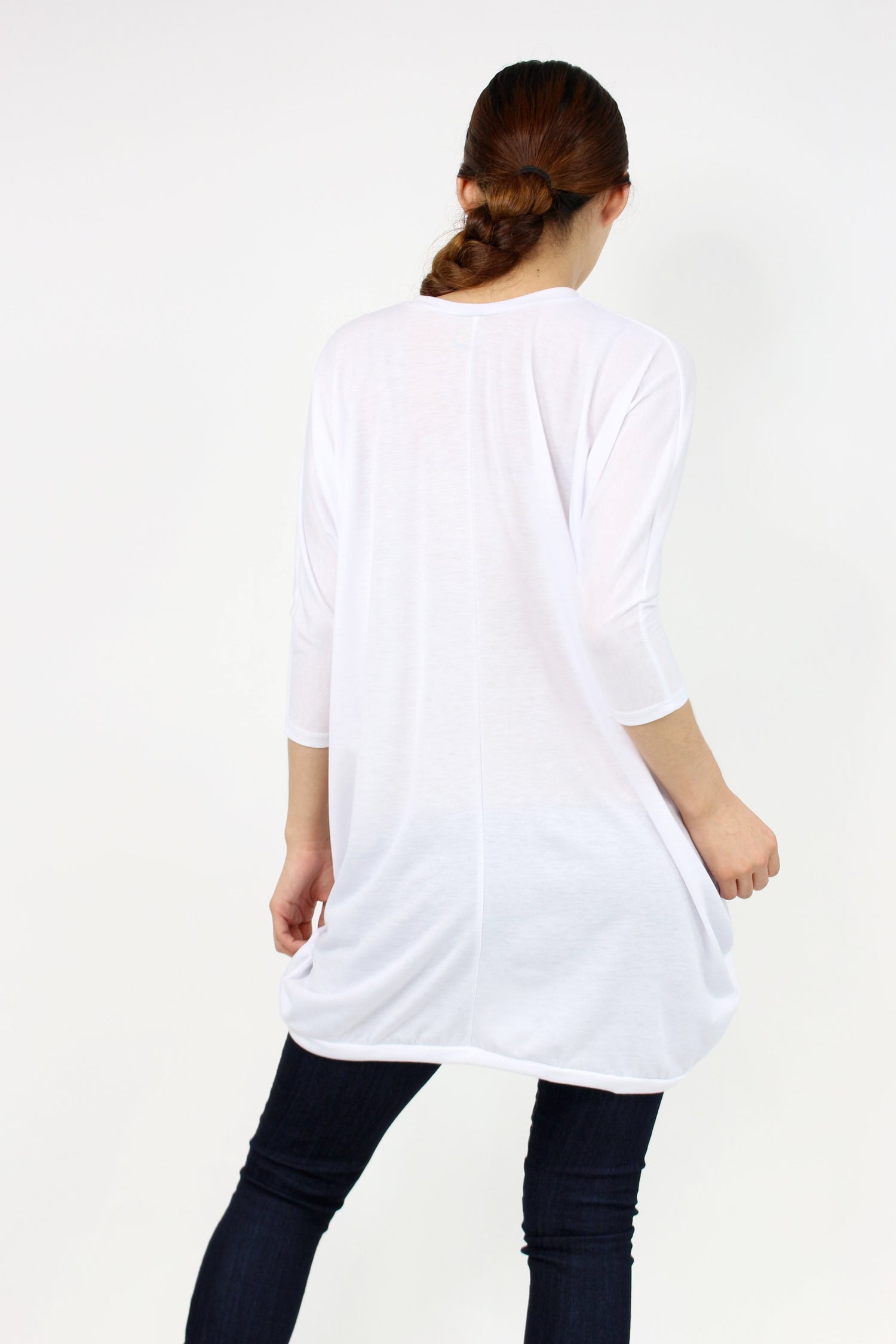 White oversized shirt dress by Yellow Hera, showing a relaxed fit with long sleeves and a classic collar.