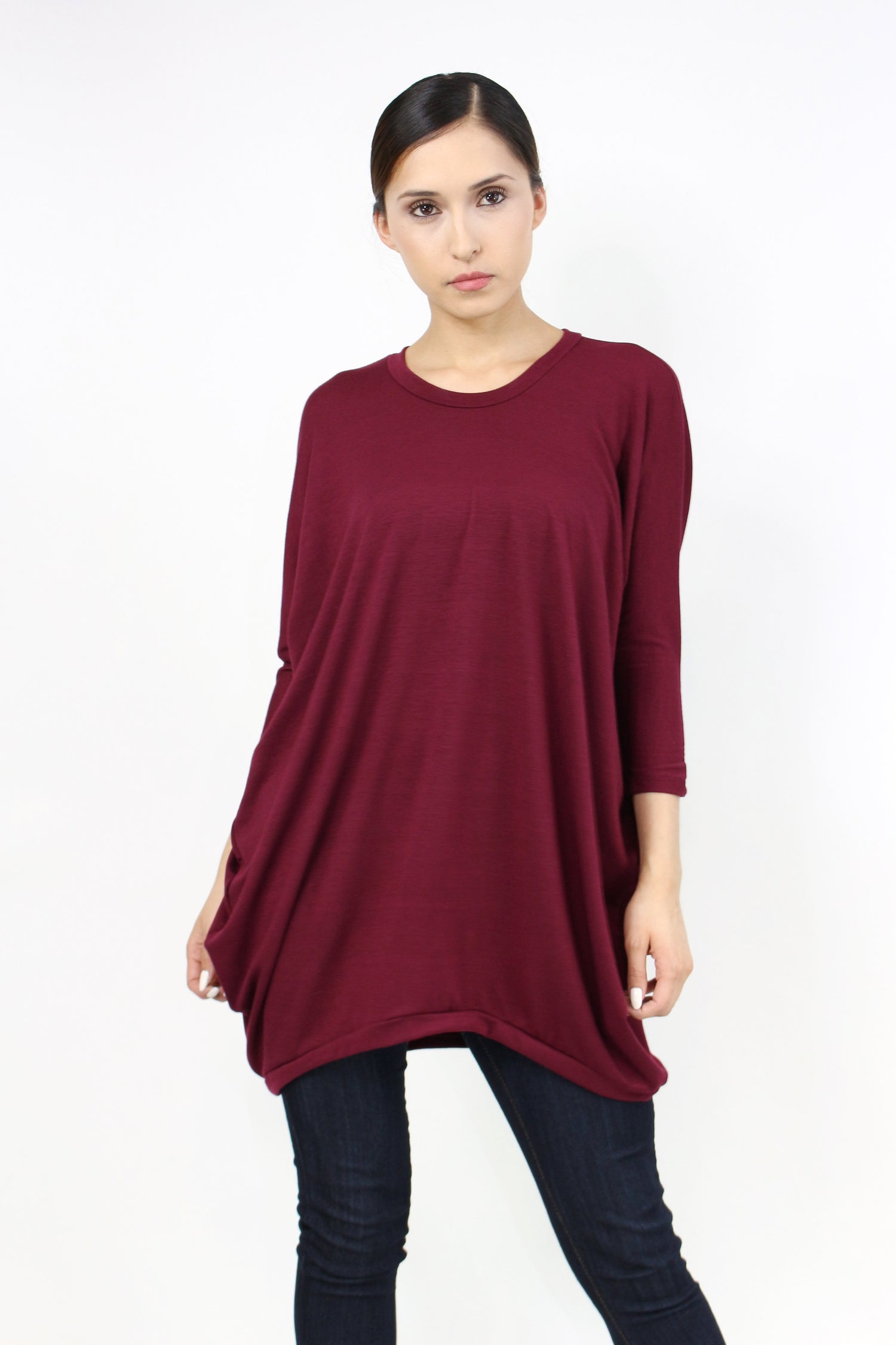 Yellow Hera oversized burgundy shirt dress hanging on a wooden hanger, showcasing casual, relaxed fashion for women.
