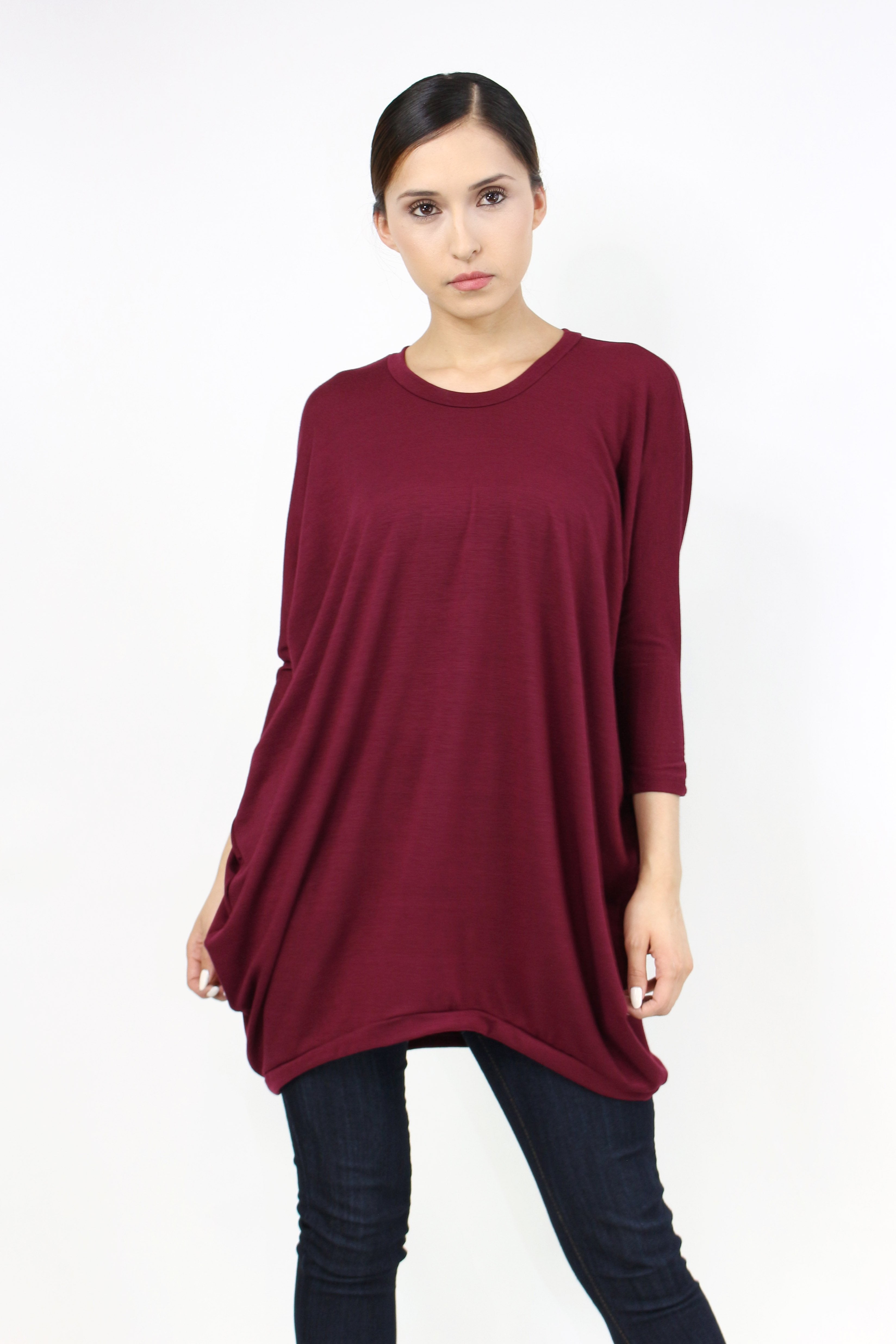 Yellow Hera oversized burgundy shirt dress hanging on a wooden hanger, showcasing casual, relaxed fashion for women.