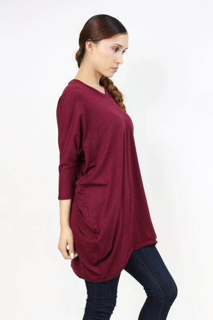 Yellow Hera oversized burgundy shirt dress hanging on a rack, showcasing relaxed fit and stylish casual clothing.