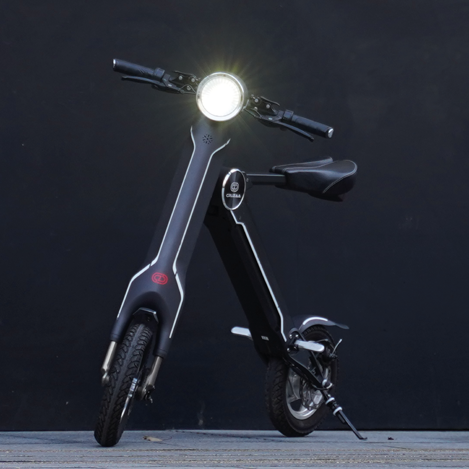Cruzaa PRO electric scooter in carbon black with built-in Bluetooth speakers, USB port, 45km range, and 35km/h top speed.
